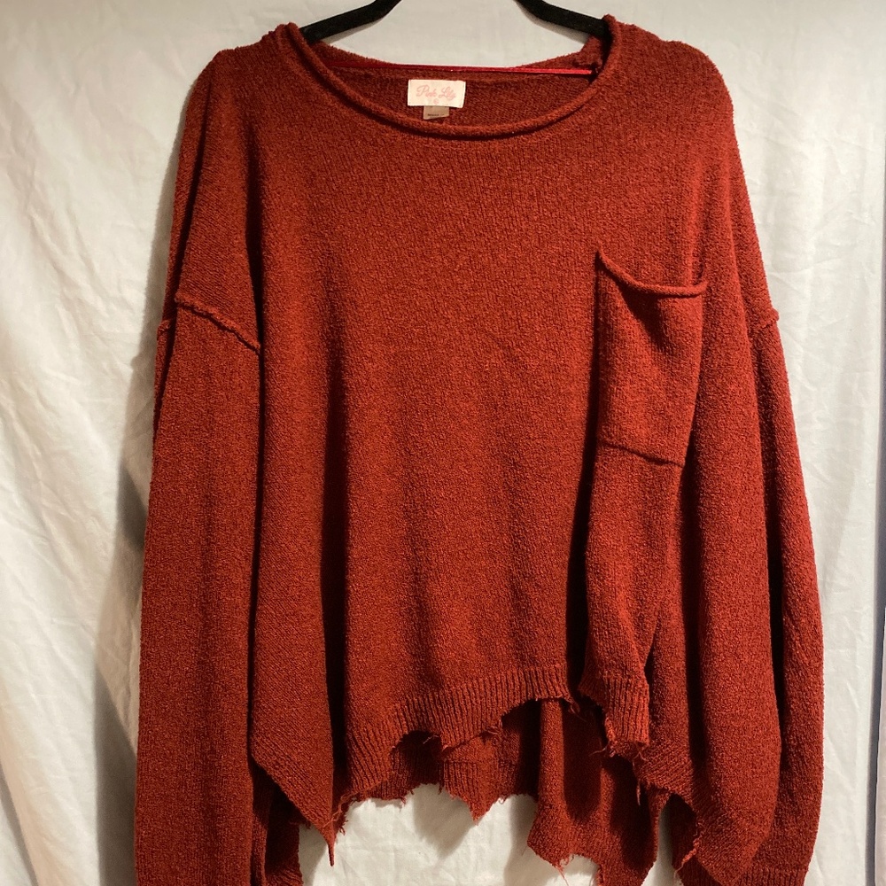 Red frayed sweater with front pocket